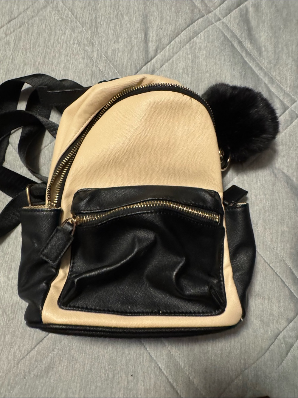 Beige and Black Mini Backpack Purse with Pom Pom Accent